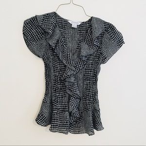 Black and white ruffle shirt.